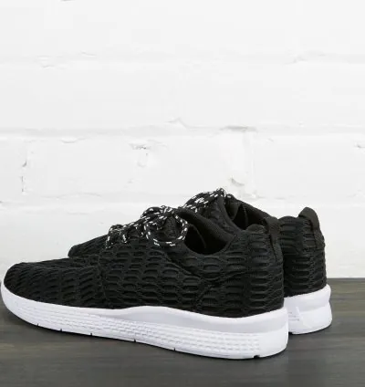 Black sneakers with white sole